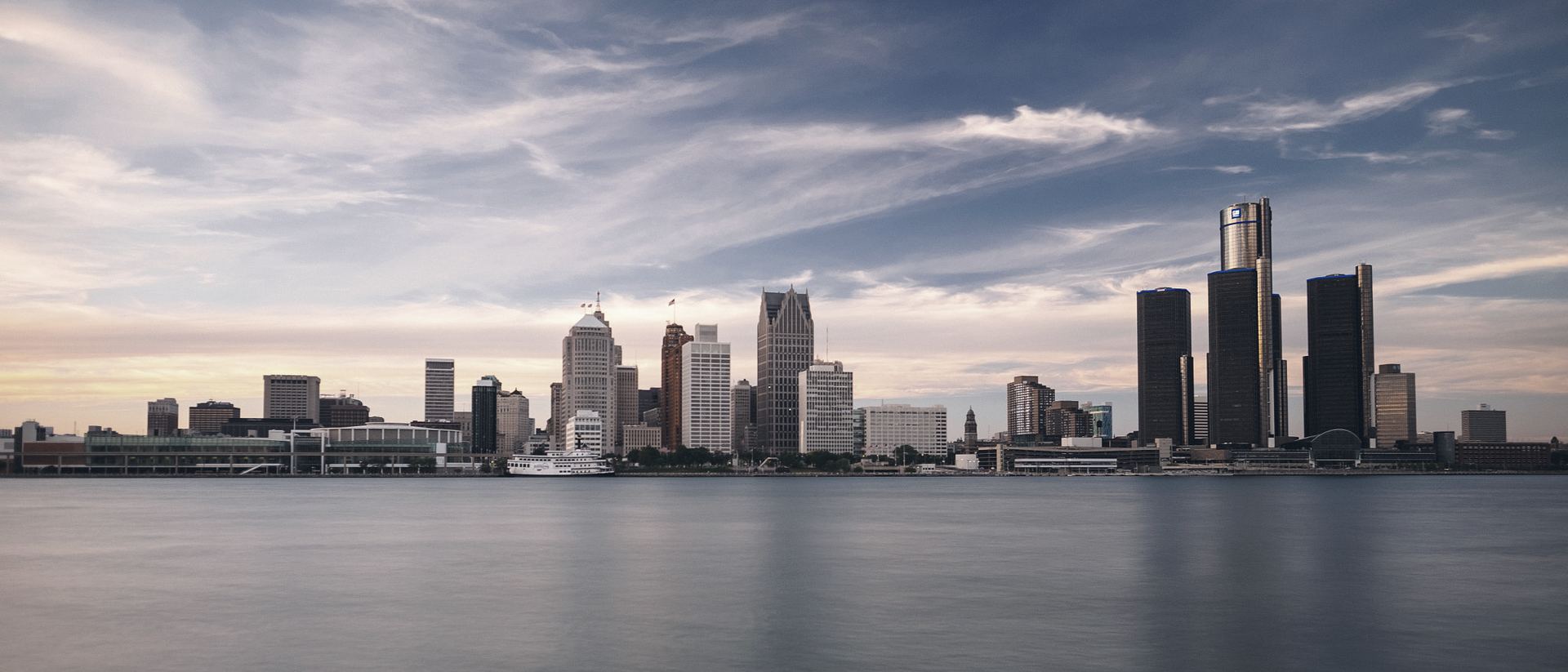 The Detroit skyline at dusk, seen across the Detroit River.